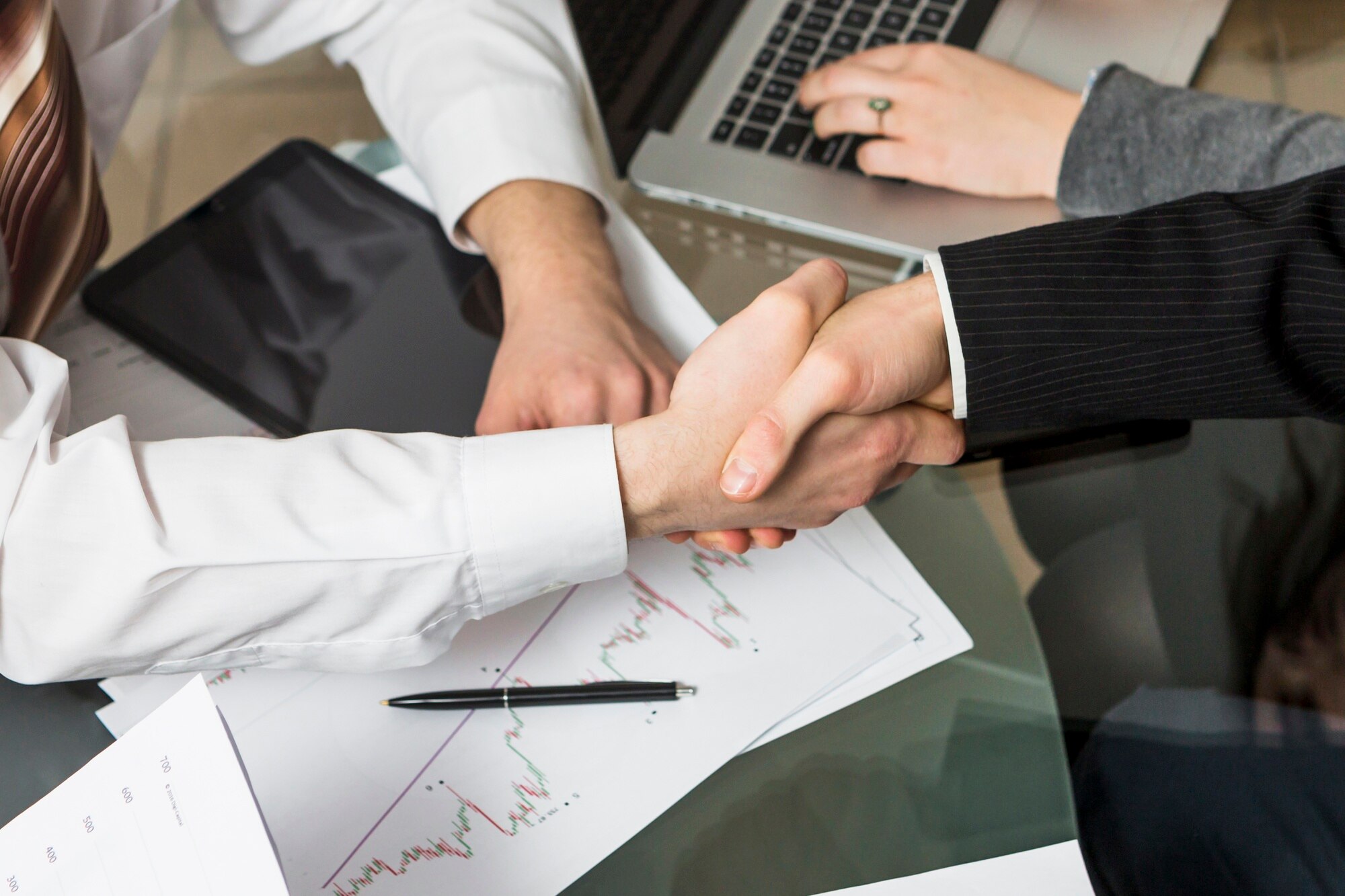 close-up-two-businesspeople-shaking-hands_23-2147838559