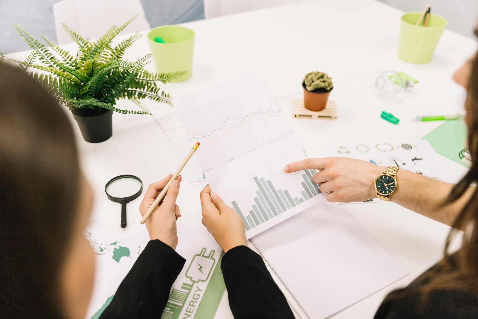group-businesspeople-analyzing-graph-office_23-2147826526